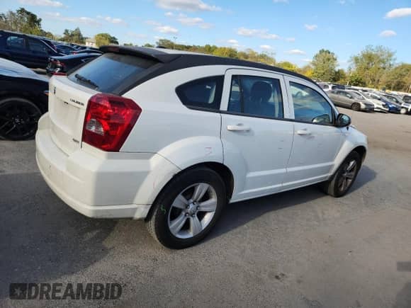 2010 Dodge Caliber SXT with VIN 1B3CB4HA9AD529504, listed as a Copart auction lot 84952075 with 194,083 mi miles and Salvage title. Bid and sale history available at DreamBid. Image 3.