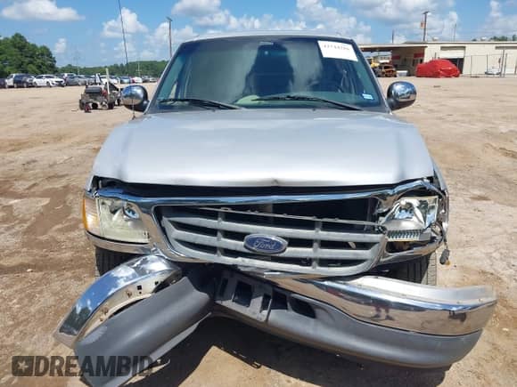 2002 Ford F-150 XLT with VIN 1FTRW07602KB73444, listed as a IAAI auction lot 42744286 with 208,152 mi miles and . Bid and sale history available at DreamBid. Image 6.