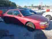 1992 Toyota Camry LE z VIN 4T1SK12E4NU036576, wystawiony jako IAAI lot #43436571 z przebiegiem 160 337 mil mil oraz . Historia ofert i sprzedaży dostępna na DreamBid. Obrazek 1.