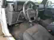 2005 Jeep Wrangler X with VIN 1J4FA39S35P323755, listed as a Copart auction lot 81223145 with 150,964 mi miles and Salvage title. Bid and sale history available at DreamBid. Image 8.