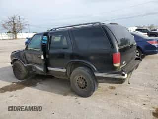 1997 Chevrolet Blazer LS z VIN 1GNDT13W2V2128712, wystawiony jako Copart lot #69841254 z przebiegiem 196 720 mil mil oraz Szkoda całkowita • Salvage title. Historia ofert i sprzedaży dostępna na DreamBid. Obrazek 2.