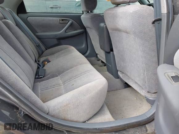 1997 Toyota Camry LE z VIN 4T1BG22K1VU106032, wystawiony jako IAAI lot #43108187 z przebiegiem Nie podano mil oraz . Historia ofert i sprzedaży dostępna na DreamBid. Obrazek 8.