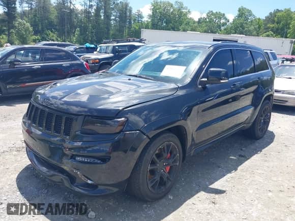 2014 Jeep Grand Cherokee SRT-8 z VIN 1C4RJFDJ2EC131267, wystawiony jako IAAI lot #42301339 z przebiegiem 174 980 mil mil oraz . Historia ofert i sprzedaży dostępna na DreamBid. Obrazek 2.