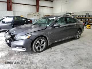 2018 Honda Accord EX z VIN 1HGCV1F44JA264561, wystawiony jako Copart lot #82487525 z przebiegiem 42 684 mil mil oraz Szkoda całkowita • Salvage title. Historia ofert i sprzedaży dostępna na DreamBid. Obrazek 1.