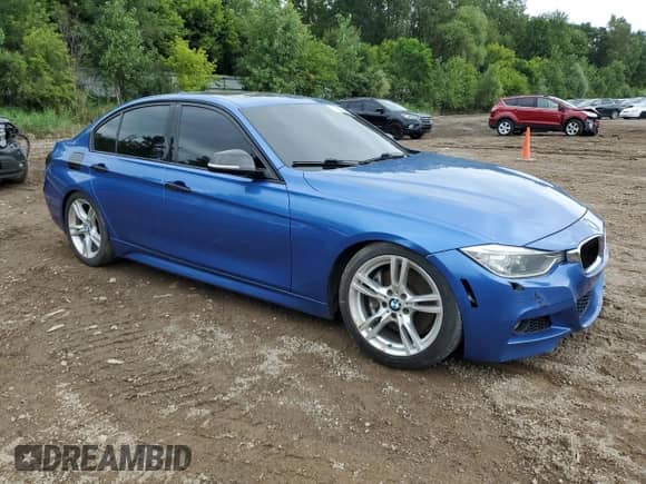2015 BMW 3 Series 335i xDrive with VIN WBA3B9C54FF589141, listed as a Copart auction lot 69980065 with 148,486 mi miles and Clean title. Bid and sale history available at DreamBid. Image 4.