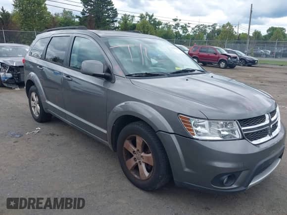 2012 Dodge Journey SXT z VIN 3C4PDDBG1CT213809, wystawiony jako IAAI lot #43049048 z przebiegiem 178 647 mil mil oraz . Historia ofert i sprzedaży dostępna na DreamBid. Obrazek 1.