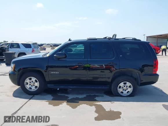 2014 Chevrolet Tahoe LT with VIN 1GNSCBE07ER190040, listed as a IAAI auction lot 42393145 with 111,605 mi miles and . Bid and sale history available at DreamBid. Image 14.