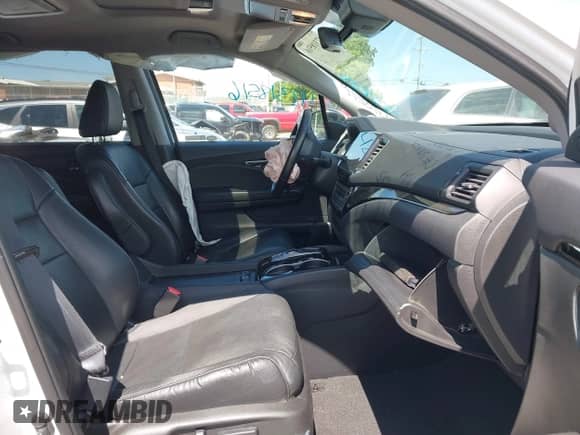 2020 Honda Pilot Touring 7-Passenger z VIN 5FNYF5H69LB000835, wystawiony jako IAAI lot #42318516 z przebiegiem 122 572 mil mil oraz . Historia ofert i sprzedaży dostępna na DreamBid. Obrazek 5.