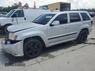 2007 Jeep Grand Cherokee SRT-8 with VIN 1J8HR78397C575828, listed as a Copart auction lot 64437325 with Not provided miles and Salvage title. Bid and sale history available at DreamBid. Image 1.