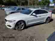 2016 BMW 4 Series 428i xDrive with VIN WBA4C9C54GG137896, listed as a Copart auction lot 87057905 with 223,537 mi miles and Salvage title. Bid and sale history available at DreamBid. Image 1.