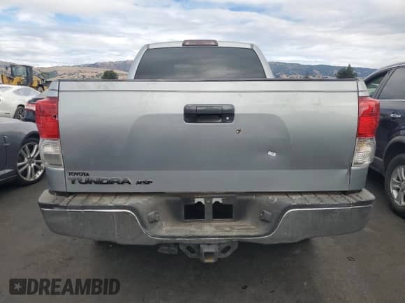 2010 Toyota Tundra with VIN 5TFRM5F13AX019787, listed as a Copart auction lot 81890665 with 110,798 mi miles and Salvage title. Bid and sale history available at DreamBid. Image 6.