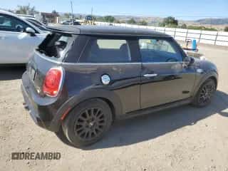 2015 MINI Hardtop S with VIN WMWXP7C55F2A40386, listed as a Copart auction lot 57690135 with 150,251 mi miles and Salvage title. Bid and sale history available at DreamBid. Image 3.