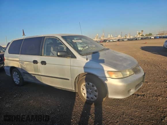 2001 Honda Odyssey LX z VIN 2HKRL18501H617598, wystawiony jako Copart lot #87778835 z przebiegiem 125 333 mil mil oraz Czysty tytuł • Clean title. Historia ofert i sprzedaży dostępna na DreamBid. Obrazek 1.