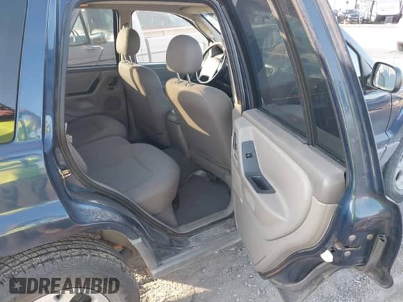 2002 Jeep Grand Cherokee Sport with VIN 1J4GW38S32C181840, listed as a IAAI auction lot 43237876 with 157,878 mi miles and . Bid and sale history available at DreamBid. Image 8.