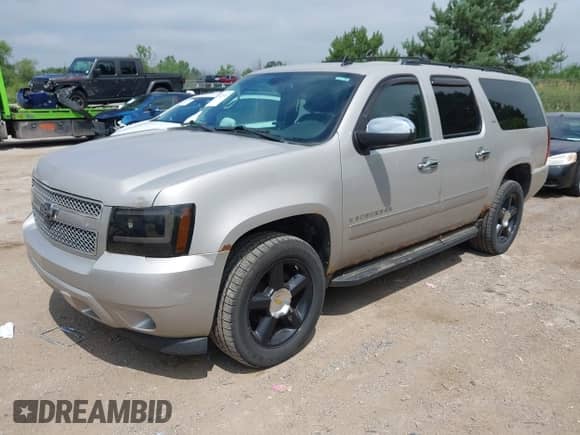 2009 Chevrolet Suburban LTZ z VIN 1GNFK363X9J100709, wystawiony jako IAAI lot #42687530 z przebiegiem 251 856 mil mil oraz . Historia ofert i sprzedaży dostępna na DreamBid. Obrazek 2.