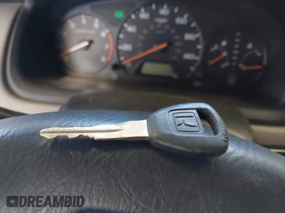 1999 Honda Accord LX z VIN 1HGCG3246XA015585, wystawiony jako IAAI lot #42795196 z przebiegiem 236 227 mil mil oraz . Historia ofert i sprzedaży dostępna na DreamBid. Obrazek 11.