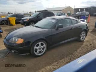 2004 Hyundai Tiburon GT с VIN KMHHN65F54U112663, выставлен на аукционе Copart как лот 60543975 с пробегом 51 589 миль миль и Списание • Salvage title. История ставок и продаж доступна на DreamBid. Изображение 1.