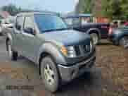 2007 Nissan Frontier LE with VIN 1N6AD07W17C402392, listed as a Copart auction lot 83113564 with 152,584 mi miles and Salvage title. Bid and sale history available at DreamBid. Image 4.