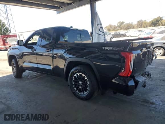 2023 Toyota Tundra SR5 with VIN 5TFLA5DA7PX129459, listed as a Copart auction lot 67829615 with 59,761 mi miles and Salvage title. Bid and sale history available at DreamBid. Image 2.