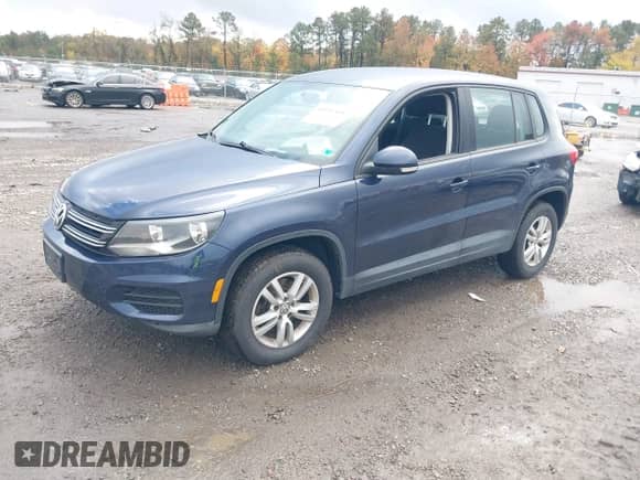 2014 Volkswagen Tiguan S with VIN WVGAV3AX7EW626163, listed as a IAAI auction lot 43591364 with 198,283 mi miles and . Bid and sale history available at DreamBid. Image 17.