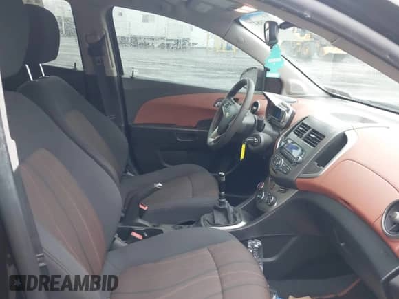 2012 Chevrolet Sonic LT with VIN 1G1JD6SH4C4176084, listed as a IAAI auction lot 41479847 with 57,690 mi miles and . Bid and sale history available at DreamBid. Image 5.