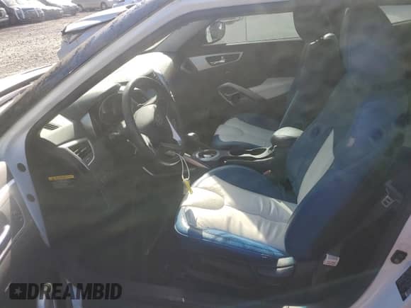 2012 Hyundai Veloster w/Red Int z VIN KMHTC6AD5CU058901, wystawiony jako Copart lot #69244165 z przebiegiem 97 260 mil mil oraz Szkoda całkowita • Salvage title. Historia ofert i sprzedaży dostępna na DreamBid. Obrazek 7.