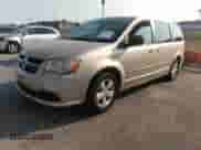 2013 Dodge Grand Caravan SE with VIN 2C4RDGBG0DR535890, listed as a IAAI auction lot 40304162 with 134,857 mi miles and . Bid and sale history available at DreamBid. Image 2.