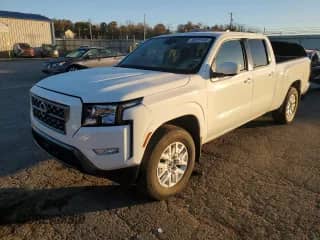 2023 Nissan Frontier SV with VIN 1N6ED1FK9PN653056, listed as a Copart auction lot 90321145 with 27,454 mi miles and Salvage title. Bid and sale history available at DreamBid. Image 1.