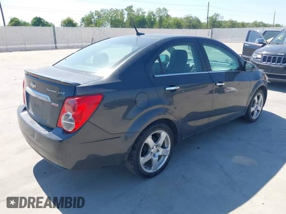 2014 Chevrolet Sonic LTZ with VIN 1G1JE5SB6E4203338, listed as a IAAI auction lot 43414724 with 126,365 mi miles and . Bid and sale history available at DreamBid. Image 4.