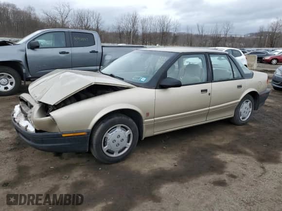 1994 Saturn SL with VIN 1G8ZH5593RZ290970, listed as a Copart auction lot 48029235 with 116,730 mi miles and Salvage title. Bid and sale history available at DreamBid. Image 1.