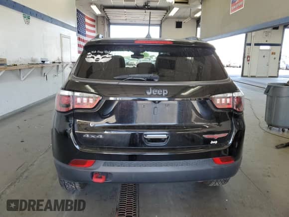 2017 Jeep Compass Trailhawk with VIN 3C4NJDDBXHT647011, listed as a Copart auction lot 65583185 with 106,438 mi miles and Salvage title. Bid and sale history available at DreamBid. Image 6.