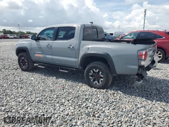 2021 Toyota Tacoma SR5 with VIN 3TMAZ5CN9MM148312, listed as a Copart auction lot 63611885 with 95,209 mi miles and Salvage title. Bid and sale history available at DreamBid. Image 2.