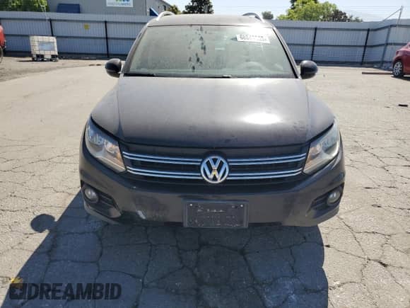 2014 Volkswagen Tiguan S with VIN WVGAV3AX5EW550118, listed as a Copart auction lot 68849335 with 189,497 mi miles and Salvage title. Bid and sale history available at DreamBid. Image 5.