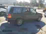 1993 Jeep Grand Cherokee Limited z VIN 1J4GZ78S3PC502345, wystawiony jako Copart lot #46933805 z przebiegiem 121 652 mil mil oraz Szkoda całkowita • Salvage title. Historia ofert i sprzedaży dostępna na DreamBid. Obrazek 3.