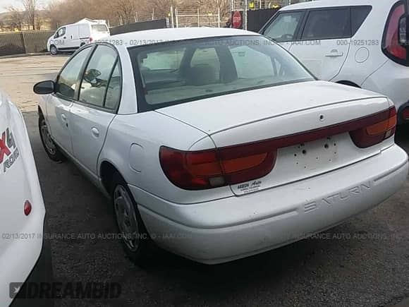 2001 Saturn SL with VIN 1G8ZK52781Z351108, listed as a IAAI auction lot 19251283 with 241,448 mi miles and . Bid and sale history available at DreamBid. Image 3.