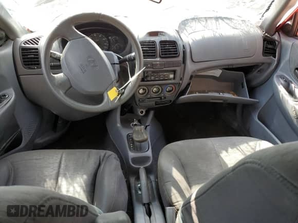 2005 Hyundai Accent GLS с VIN KMHCG45CX5U618473, выставлен на аукционе Copart как лот 76752994 с пробегом Не указан миль и Списание • Salvage title. История ставок и продаж доступна на DreamBid. Изображение 8.