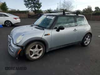 2002 MINI Hardtop with VIN WMWRC33422TC32681, listed as a Copart auction lot 52005995 with 110,228 mi miles and Salvage title. Bid and sale history available at DreamBid. Image 1.