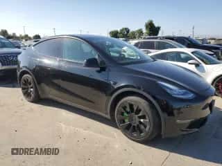 2021 Tesla Model Y Long Range with VIN 5YJYGDEE2MF182060, listed as a Copart auction lot 71448454 with 60,836 mi miles and Salvage title. Bid and sale history available at DreamBid. Image 4.