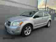 2010 Dodge Caliber SXT с VIN 1B3CB4HA1AD579409, выставлен на аукционе Copart как лот 91408935 с пробегом 100 311 миль миль и Чистый • Clean title. История ставок и продаж доступна на DreamBid. Изображение 2.