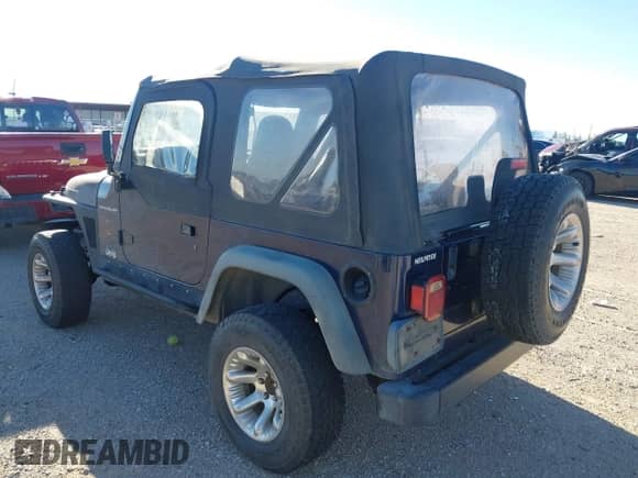 1997 Jeep Wrangler SE with VIN 1J4FY29P9VP452231, listed as a IAAI auction lot 43459509 with Not provided miles and . Bid and sale history available at DreamBid. Image 3.