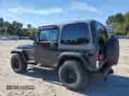 2000 Jeep Wrangler Sport with VIN 1J4FA49S1YP796600, listed as a Copart auction lot 82574545 with 128,340 mi miles and Clean title. Bid and sale history available at DreamBid. Image 2.