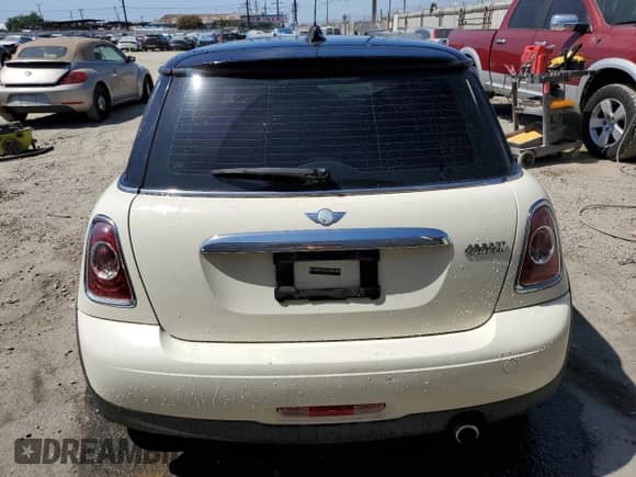 2013 MINI Hardtop with VIN WMWSU3C52DT680782, listed as a Copart auction lot 61779515 with 94,378 mi miles and Salvage title. Bid and sale history available at DreamBid. Image 6.