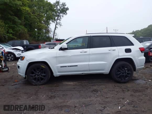 2020 Jeep Grand Cherokee Laredo E with VIN 1C4RJFAG9LC271385, listed as a IAAI auction lot 42468734 with 68,529 mi miles and . Bid and sale history available at DreamBid. Image 14.