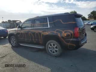 2015 Chevrolet Tahoe LTZ with VIN 1GNSKCKC0FR149001, listed as a Copart auction lot 81328555 with 184,985 mi miles and Salvage title. Bid and sale history available at DreamBid. Image 2.