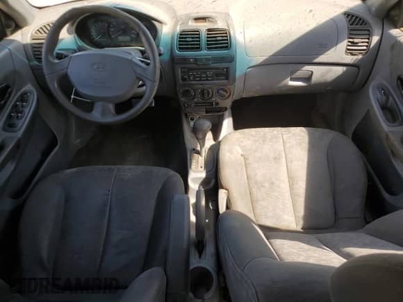 2003 Hyundai Accent GL z VIN KMHCG45CX3U474856, wystawiony jako Copart lot #67615445 z przebiegiem 205 400 mil mil oraz Szkoda całkowita • Salvage title. Historia ofert i sprzedaży dostępna na DreamBid. Obrazek 8.