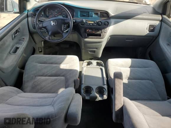 2002 Honda Odyssey EX z VIN 2HKRL18682H551537, wystawiony jako Copart lot #84208275 z przebiegiem 128 632 mil mil oraz Szkoda całkowita • Salvage title. Historia ofert i sprzedaży dostępna na DreamBid. Obrazek 8.