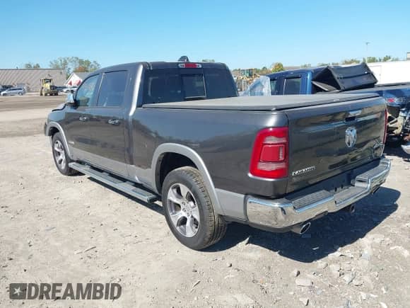 2020 Ram 1500 Laramie with VIN 1C6SRFRT7LN344695, listed as a IAAI auction lot 43316492 with 57,326 mi miles and . Bid and sale history available at DreamBid. Image 3.