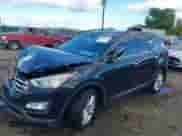 2014 Hyundai Santa Fe z VIN 5XYZUDLA7EG156349, wystawiony jako IAAI lot #43368098 z przebiegiem 128 126 mil mil oraz . Historia ofert i sprzedaży dostępna na DreamBid. Obrazek 2.