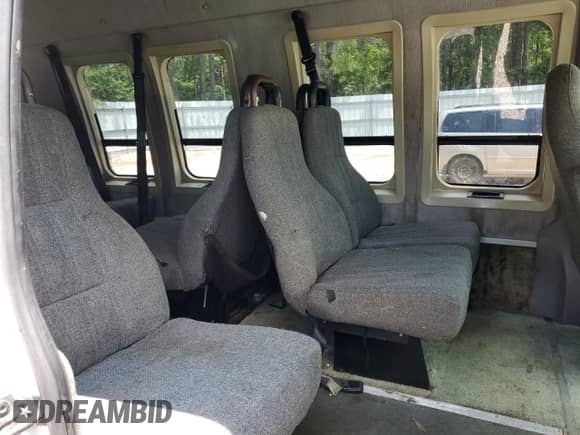 1999 Ford Econoline Cargo z VIN 1FDNS24L2XHB77253, wystawiony jako Copart lot #59782695 z przebiegiem 272 196 mil mil oraz Czysty tytuł • Clean title. Historia ofert i sprzedaży dostępna na DreamBid. Obrazek 11.
