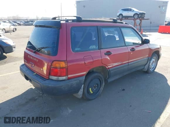 1999 Subaru Forester L with VIN JF1SF6355XG730057, listed as a IAAI auction lot 36998083 with Not provided miles and . Bid and sale history available at DreamBid. Image 4.